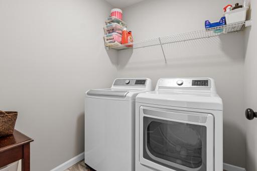Upper level laundry room - washer and dryer to stay with the home