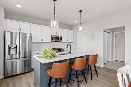 A mudroom area with closet connects you to your attached 3 car garage