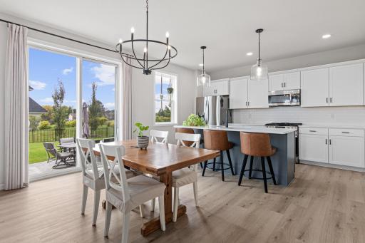 Open living/dining setup with access to your backyard patio and fully fenced yard