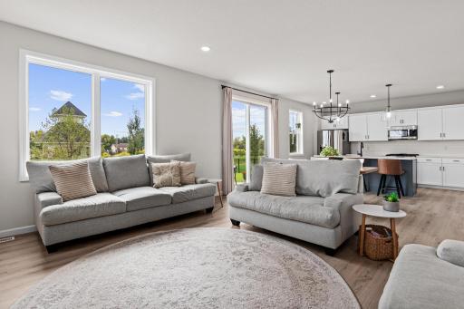 Main floor features LVP flooring and 9ft ceilings