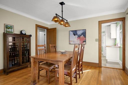 A beautiful, original door separates the dining and living rooms from the hallway to the bedrooms