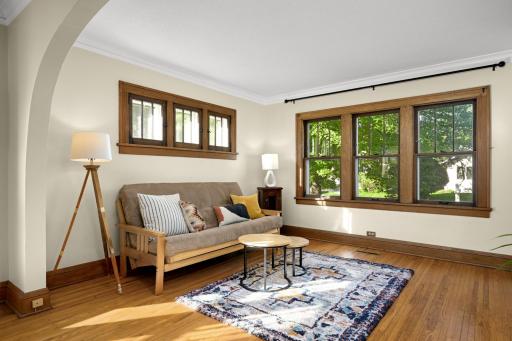 Living room with beautiful woodwork and hardwood floors