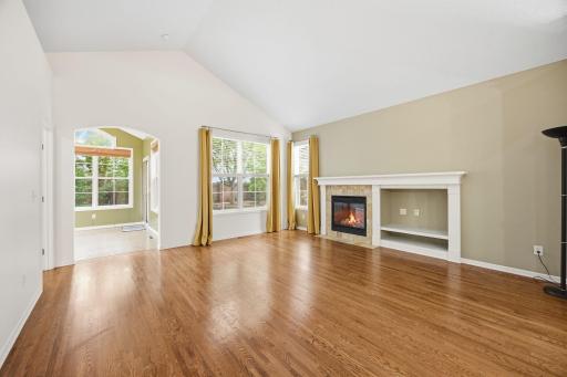 Spacious, vaulted living room with gas fireplace.