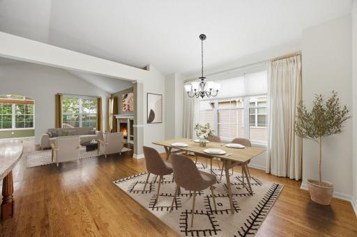 Virtually Staged - Plenty of space for a large dining table and smooth flow to living room.