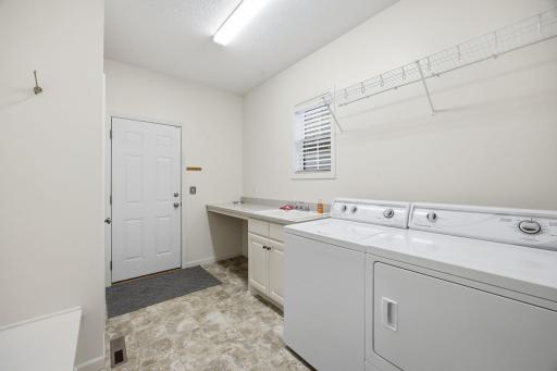 Super convenient mudroom and laundry room connected to the heated 3 car garage.