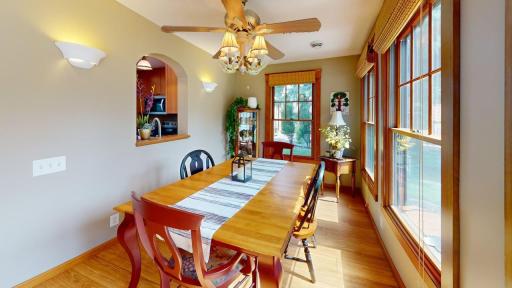 Fantastic dining room surrounded by windows, offering plenty of natural light and a spacious setting for hosting family and friends.
