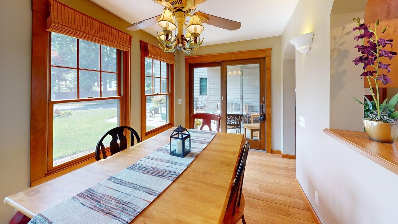 Dining room offers plenty of natural light with sliding glass doors opening to the front patio for easy indoor-outdoor entertaining.