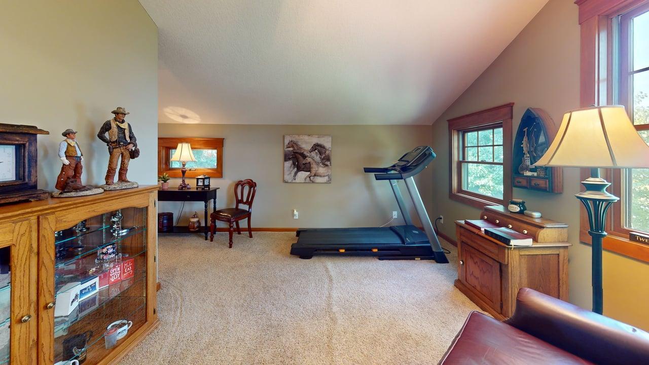 Spacious upper-level family room with vaulted ceilings, plenty of natural light and flexible space for relaxing, exercising or hobbies.