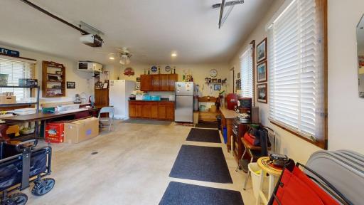 Spacious and heated attached double garage offers plenty of room for vehicles, storage and additional workspace.