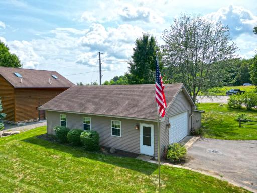 Spacious double detached garage offers plenty of room to park up to four vehicles, with additional space for storage including a lean-to.