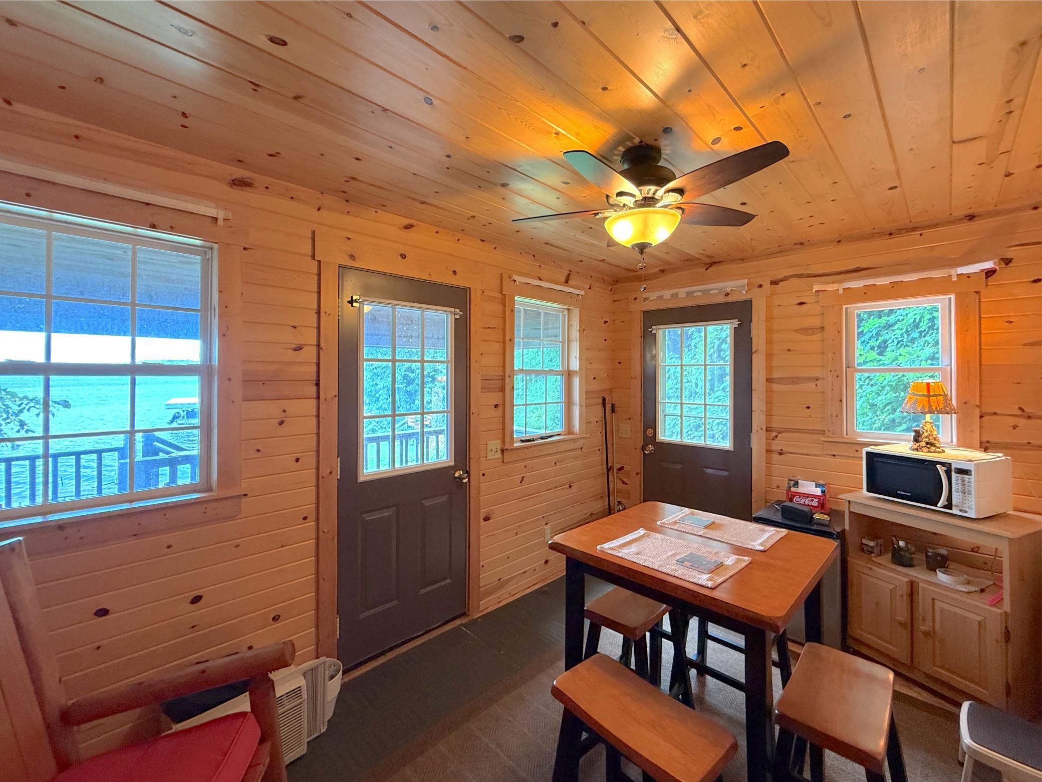 Finished in warm knotty pine, the shore-house provides a welcoming lakeside retreat with space for casual meals, changing and relaxing.