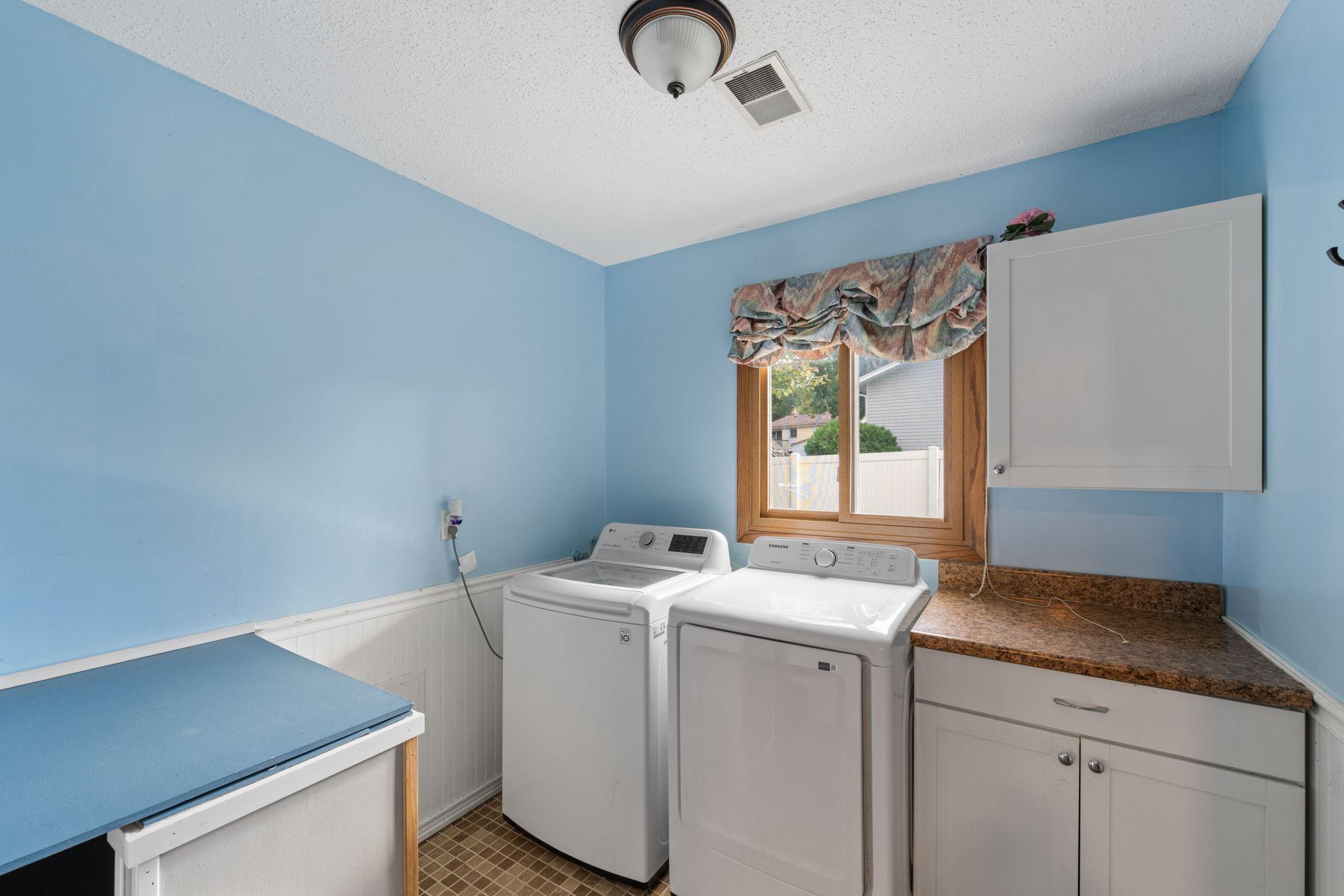 Main Level Laundry Room. Roughed in for a Shower by left cabinet