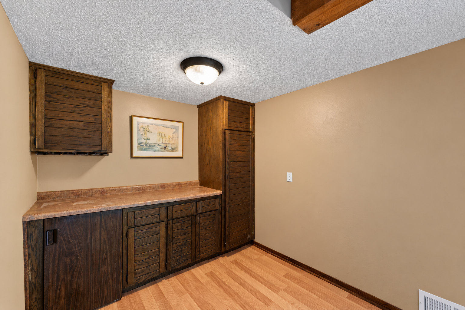 Warm Wood Cabinetry with Textured Ceiling.png