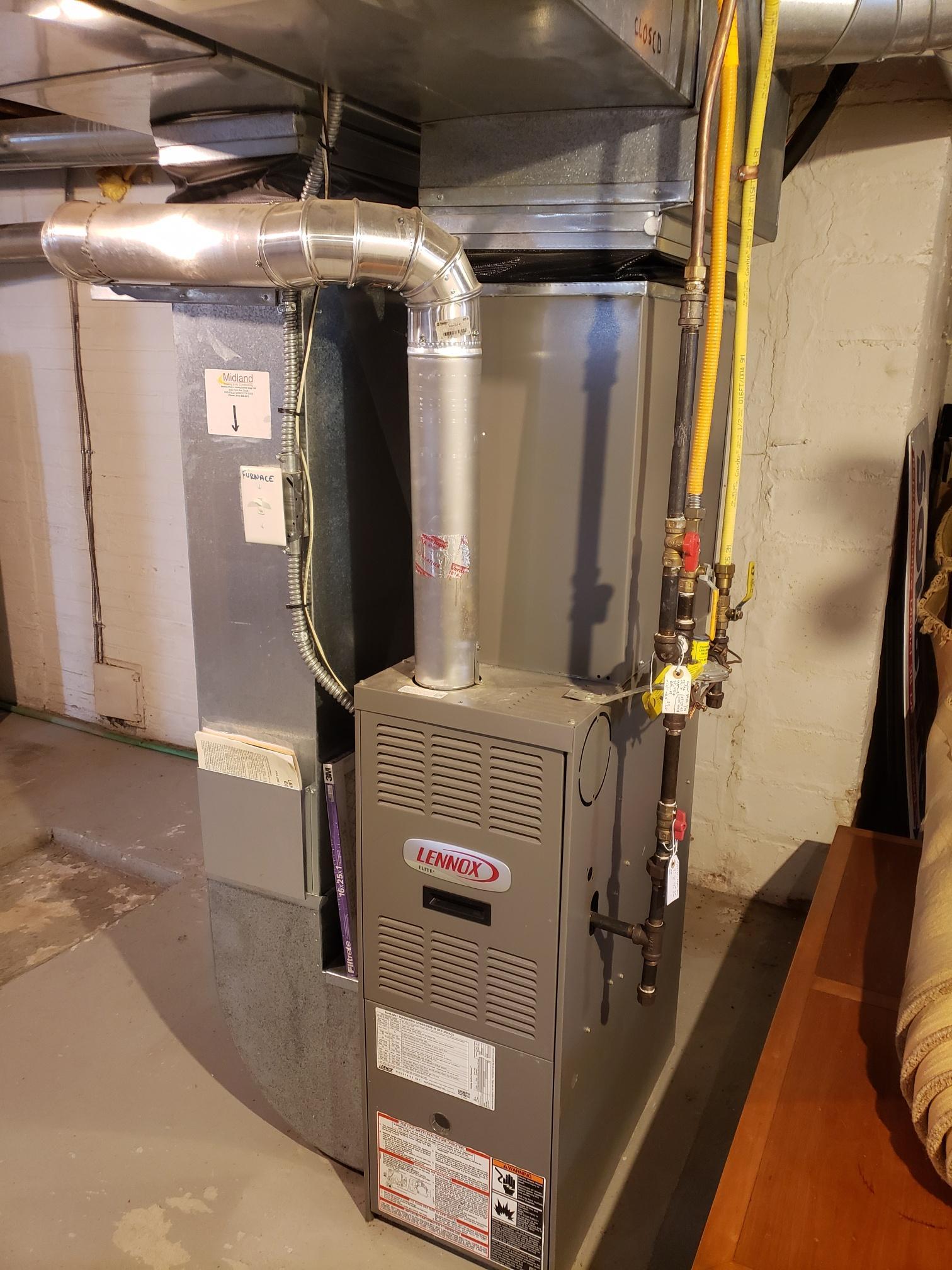 Duplex has been converted to forced air heat allowing for central air conditioning. Upper unit furnace is in the attic accessible in the rear upper hallway. Main level unit is in the basement as shown in picture.