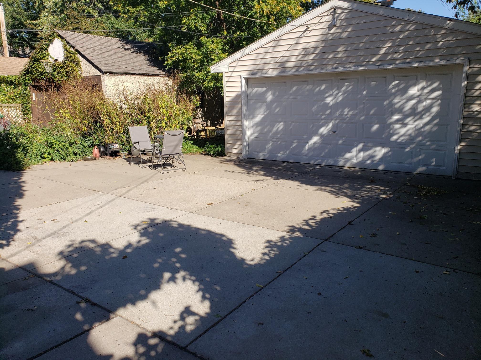 UPDATED DRIVEWAY WITH HAGE CONCRETE DRIVEWAY. PREVIOUS DRIVEWAY WAS COMPLETLY REMOVED BEFORE INSTALLATION OF THE HAGE DRIVEWAY.