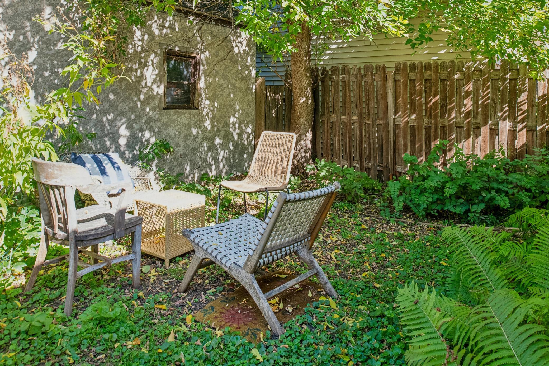 DESIRABLE SITTING AREA IN THE REAR YARD TO ENJOY COFFEE OR TEA...