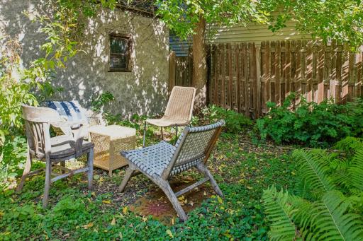 DESIRABLE SITTING AREA IN THE REAR YARD TO ENJOY COFFEE OR TEA...