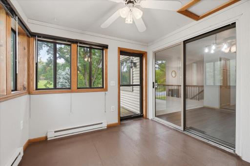 3 season sun room with walkout to nice deck