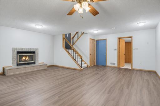 Another LL family room view with door to garage, and 3/4 bath entry
