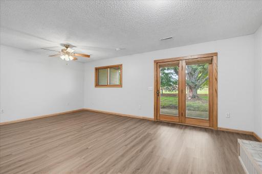 Walkout patio doors and view of the huge tree thru the doors