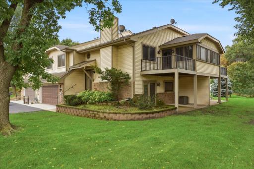 Great townhome with walkout lower level, 3 season sun room, plus nice size private deck