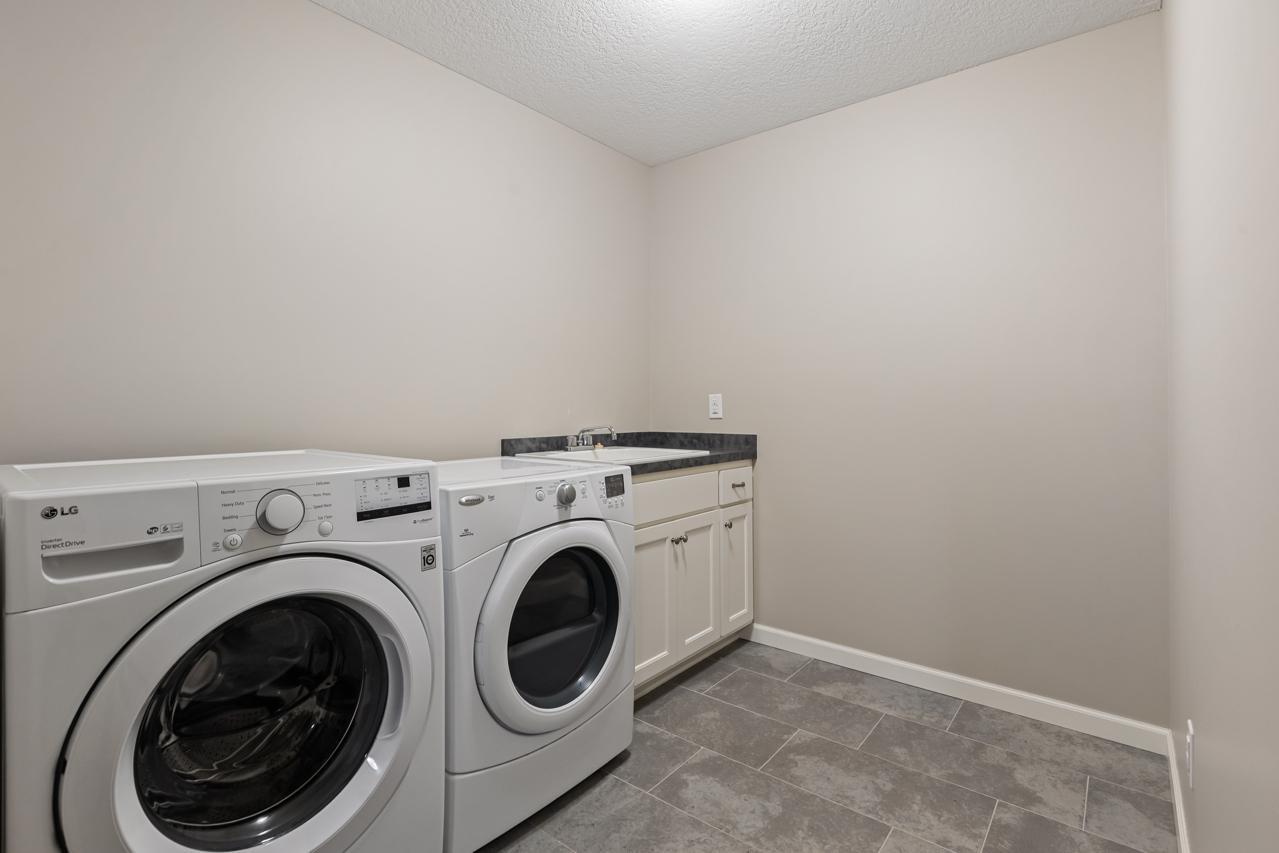 Spacious upper-level laundry room designed for easy household flow.