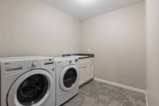 Spacious upper-level laundry room designed for easy household flow.