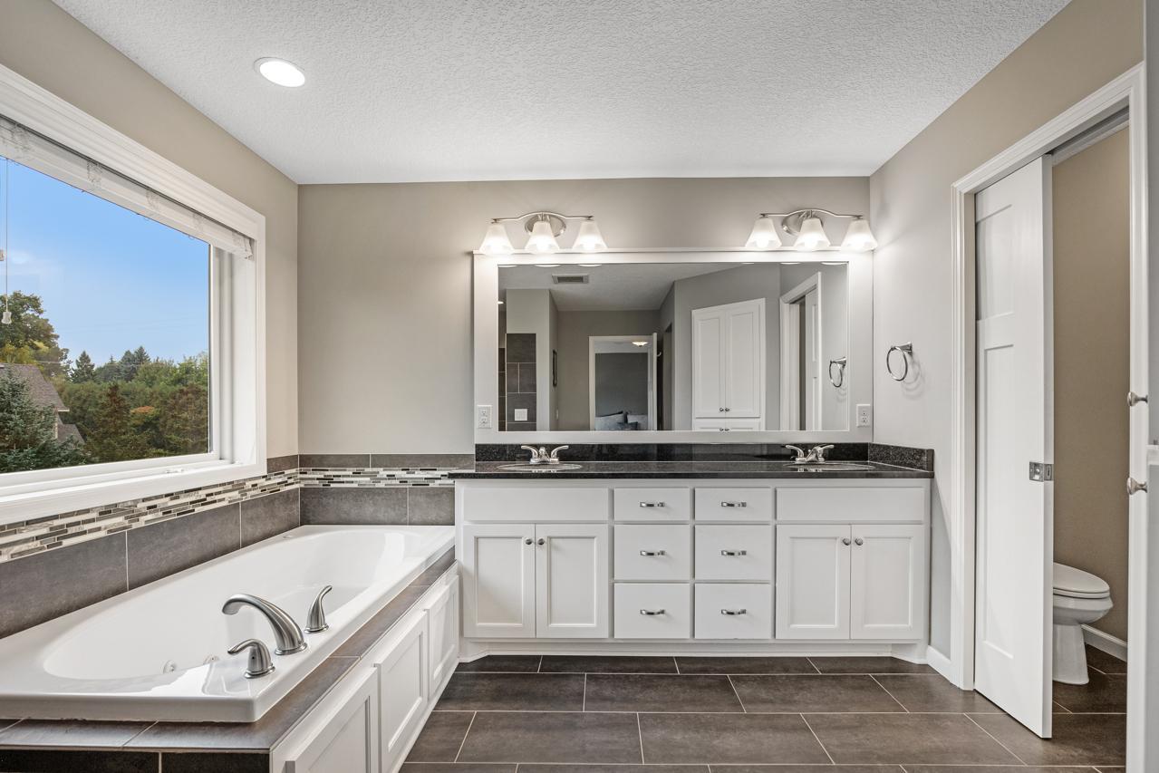 Primary bathroom includes a dedicated private toilet room, enhancing privacy and functionality.