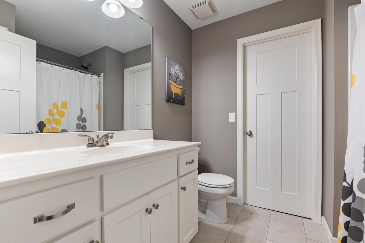 En-suite bathroom for Bedroom 2 featuring direct access to the spacious walk-in closet.