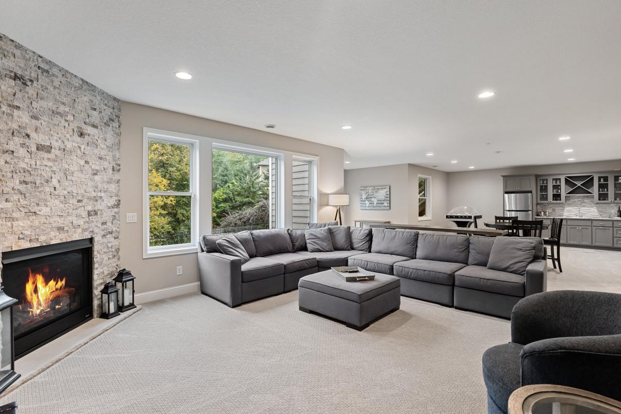 Open and functional lower-level great room offering flexible space for entertaining or everyday living.