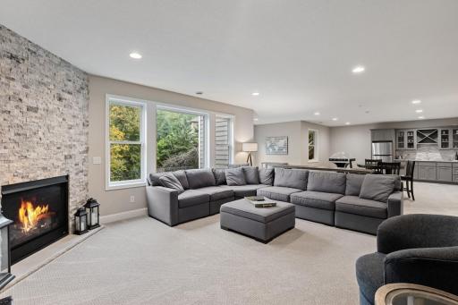 Open and functional lower-level great room offering flexible space for entertaining or everyday living.