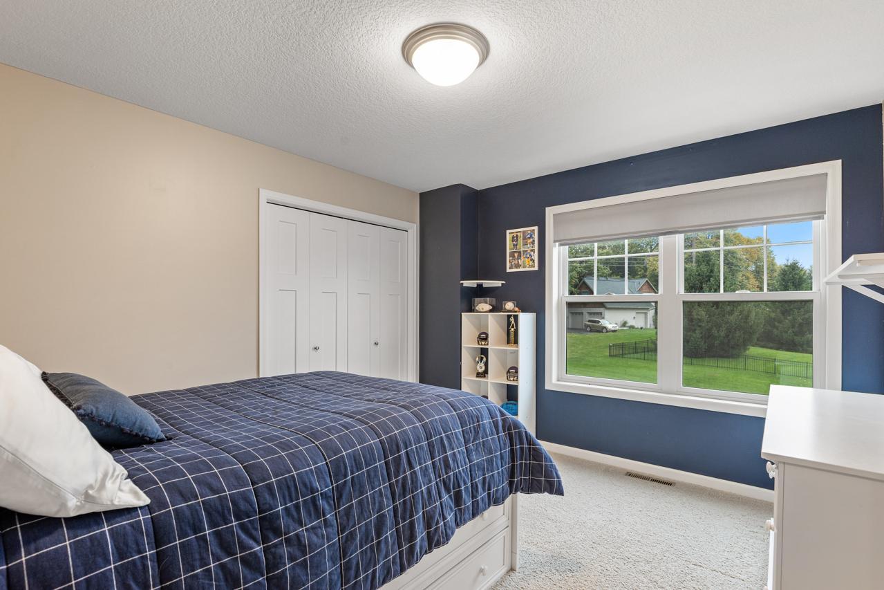 Bedroom 4 on the upper level provides a bright, comfortable retreat.