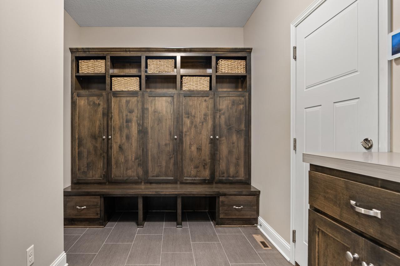Spacious mudroom offering ample storage and convenient access to the attached garage.