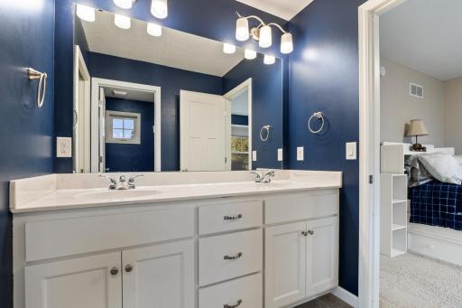 Jack-and-Jill bathroom featuring a spacious dual vanity for easy shared use.
