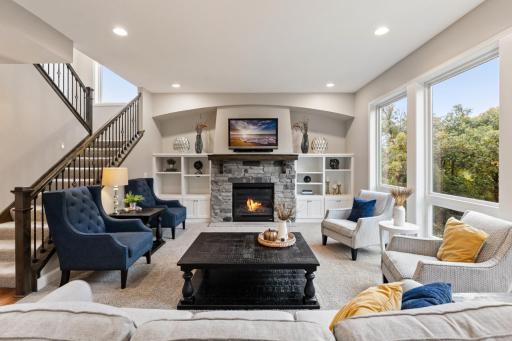 Living room visible from the kitchen, emphasizing seamless sightlines and comfortable gathering space.