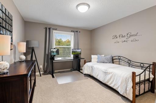 Upper-level second bedroom with generous space and a welcoming feel.