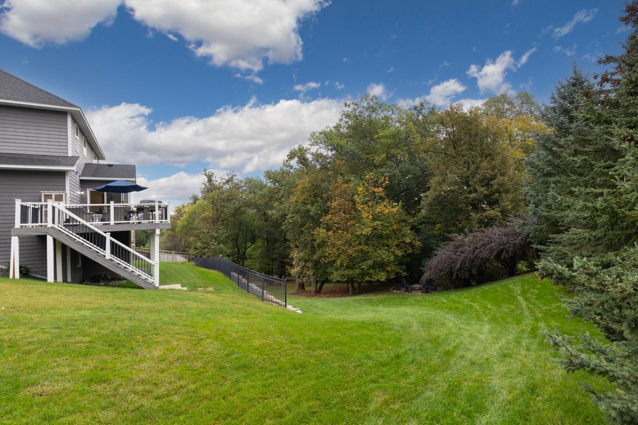 Expansive green space that creates a peaceful, open feel in the backyard.