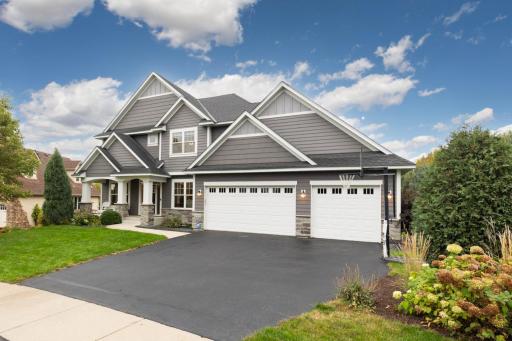 Spacious 3-car attached garage offering ample room for vehicles, storage, and gear.