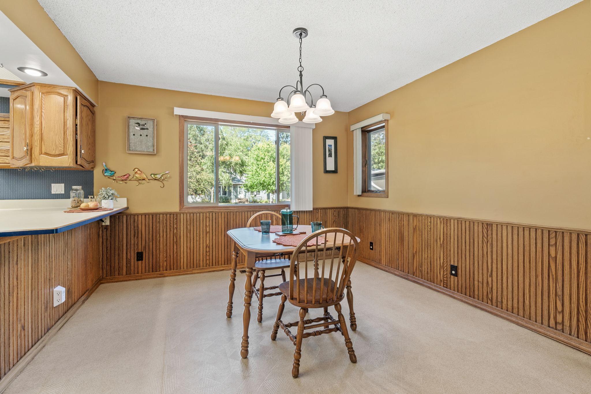 Dining room is spacious and filled with natural light
