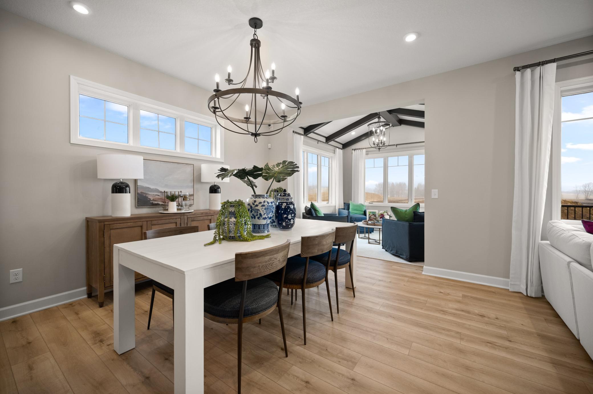 Open floor plan flows from kitchen to dining room and into the morning room! *Model home photos, many options to choose on this to be built home.*