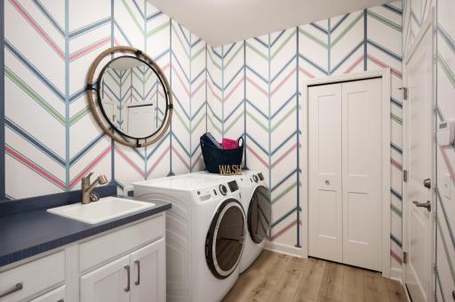 Main level laundry with service sink! Add overhead cabinets if you'd like! *Model home photos, many options to choose on this to be built home.*