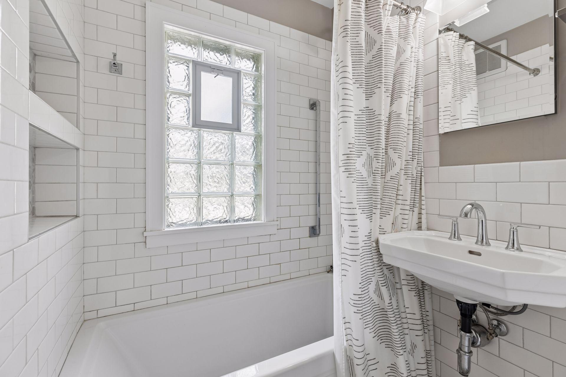 Newly updated full bathroom located on the upper level.