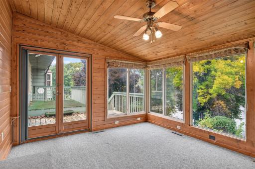 Imagine slow mornings, a cup of coffee, and a front-row seat to the changing seasons. This light-filled sunroom offers the perfect spot to relax, read, or simply take in the peaceful views.