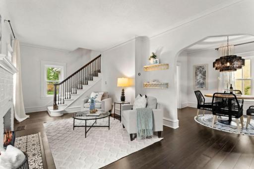 Inside, the home immediately feels comfortable and full of personality. The living room is spacious and bright, with hardwood floors running throughout the main level, updated in 2021.