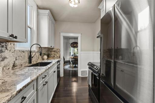 The kitchen was completely remodeled in 2024, bringing a fresh, updated feel to the home. New appliances, sleek soft-close cabinetry and a backsplash that continues directly up from the countertops give the space a clean, finished look.