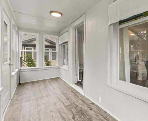 The three-season sunroom is another spot that makes this home stand out. It is an easy place to enjoy your morning coffee, curl up with a book or simply take in the mature neighborhood and tree-lined street.