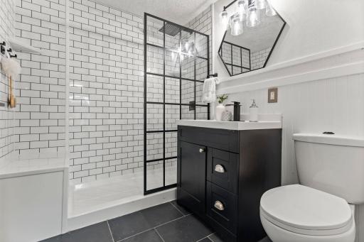 The upper-level bathroom, completely remodeled in 2022, is just steps away.