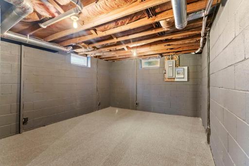 Downstairs, the full unfinished lower level provides a generous amount of storage space, plus a separate carpeted bonus room that could be used as a home gym, hobby space or whatever suits your needs.