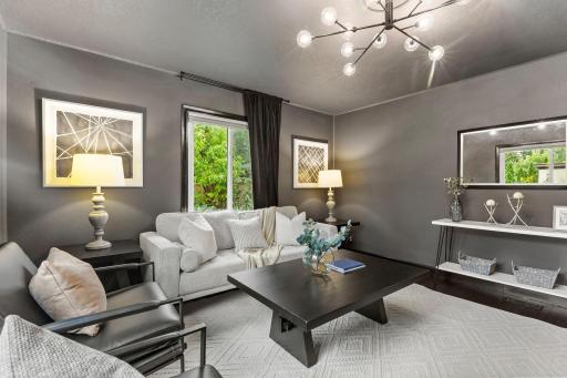 Keep it as a comfortable living space, or use it as a third bedroom or main-level primary with laundry conveniently nearby.