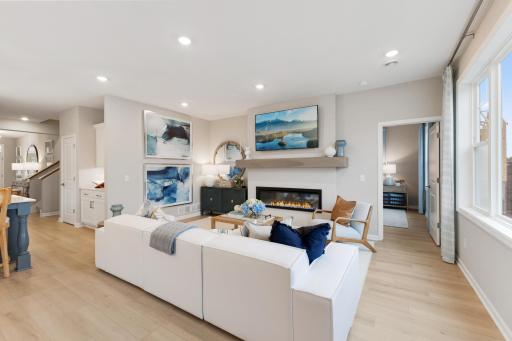 The living room has large windows allowing natural lighting to flow into this home and there are options for a fireplace, either gas or electric. *Model home photos, many options to choose on this to be built home.*
